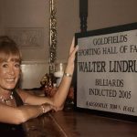 Tammy Lindrum with Walter Lindrum's Hall of Fame inductee plaque in Kalgoorlie Town Hall